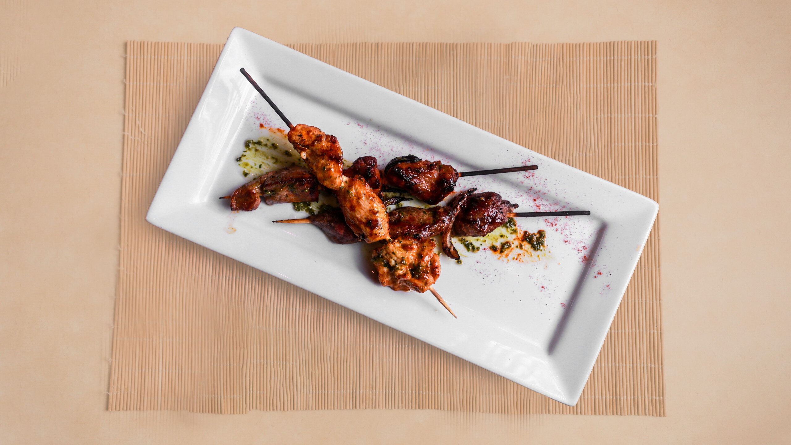 Mixed Suya Brochettes - Chicken, beef and lamb brochettes, served with choice of 2 side dishes, 1 sauce, and 1 hot sauce